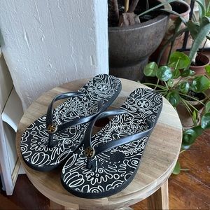 Black and white flip flops